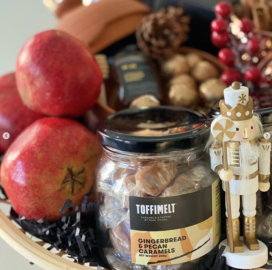 Festive gift basket with a jar of Gingerbread & Pecan Caramels